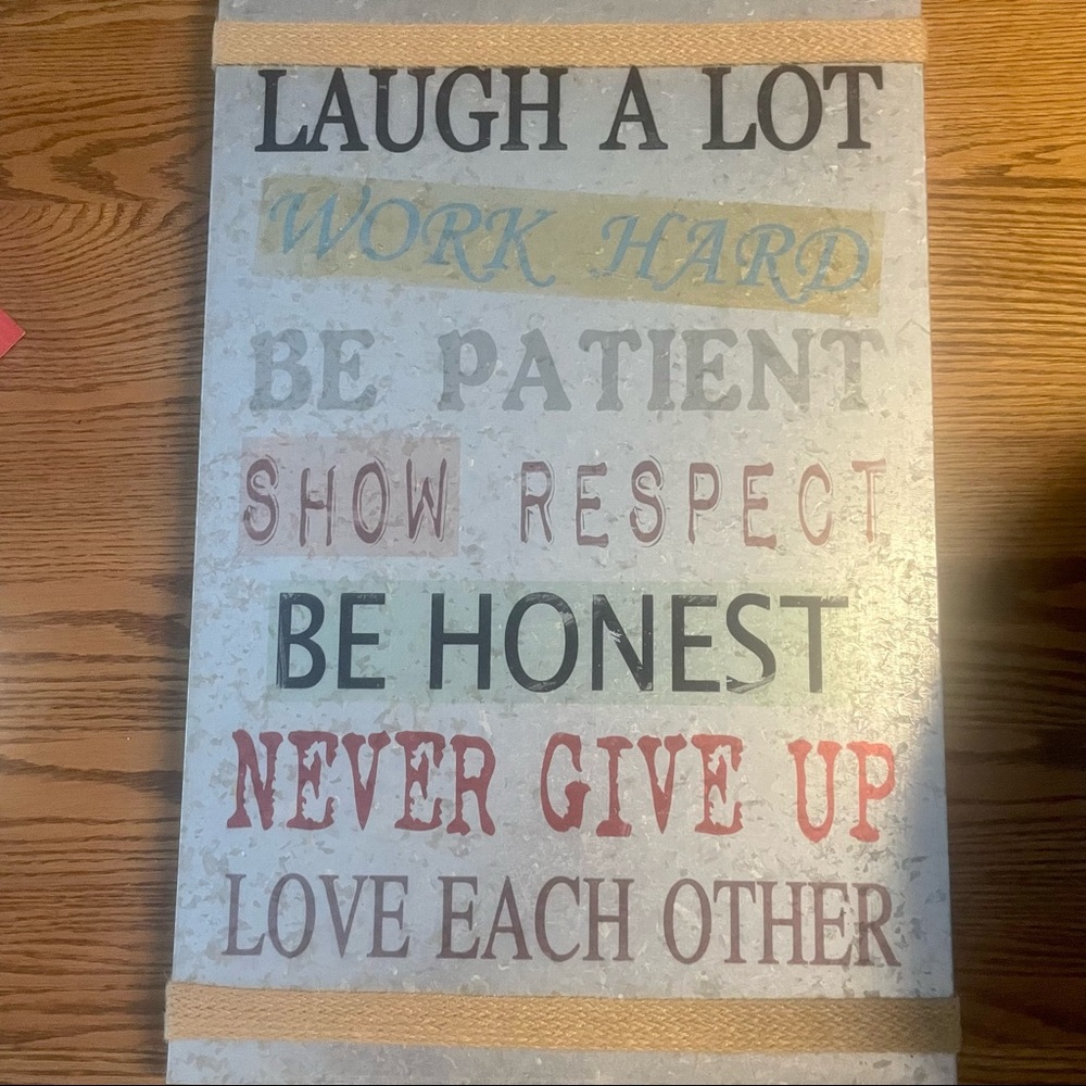 Tin/metal sign with inspirational quote.